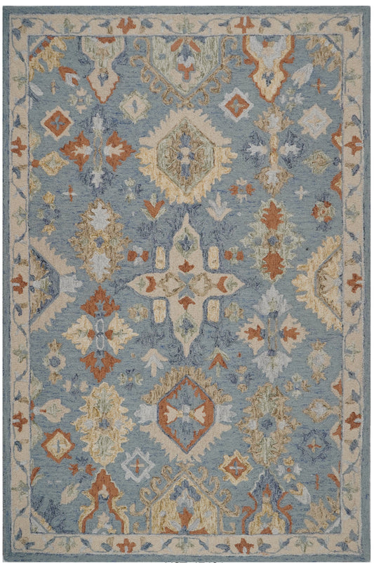 Nabhasya blue wool rug with cream ornamental medallions, rust accents and a cream floral border.